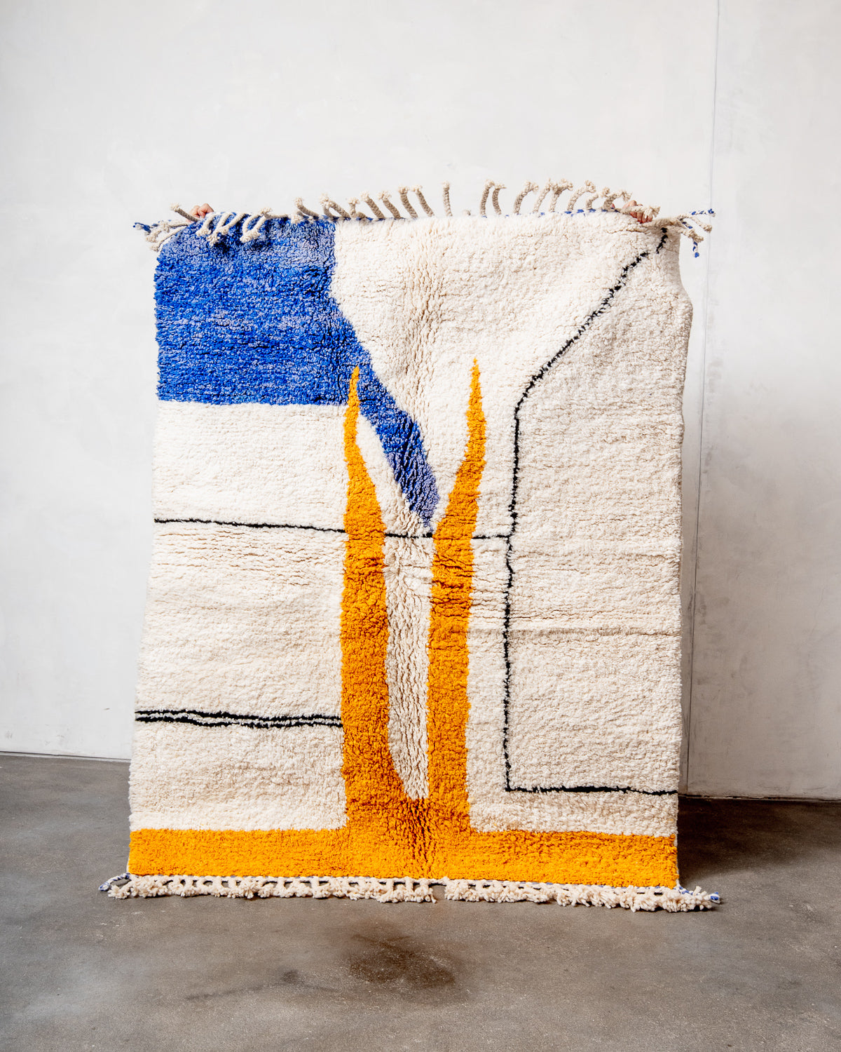 Modern, designer, handcrafted Berber rug from Morocco. Beniourain carpet with beautiful colours and patterns and fluffy wool texture.